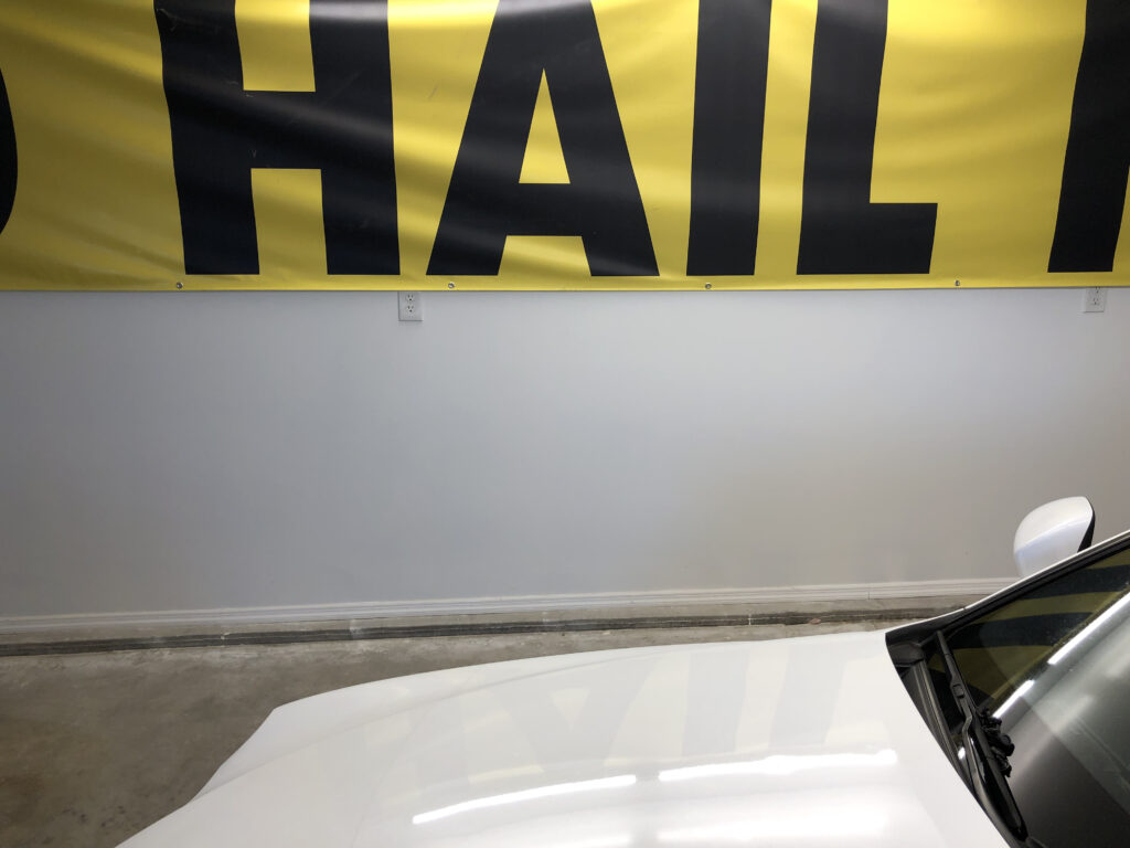 picture of a banner saying hail and a picture of a hail damage hood implying that the lord of the dings llc limited lifetime warranty is for hail damage